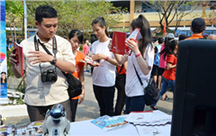 High School Students are Attracted to the at DTU Folk Culture Festival Stand
